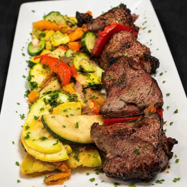 Marinated beef tenderloin Shashlyk flame-grilled with seasonal vegetables.