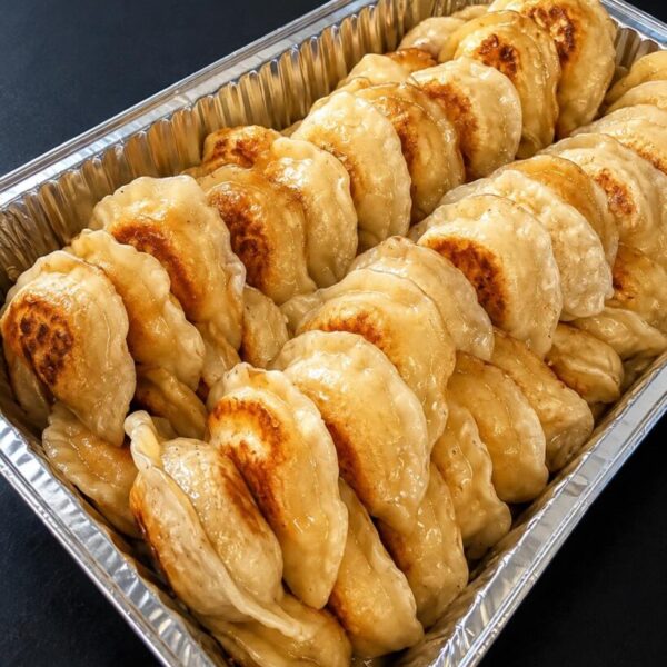 Handcrafted Ukrainian pierogis prepared by the tray for parties and gatherings.
